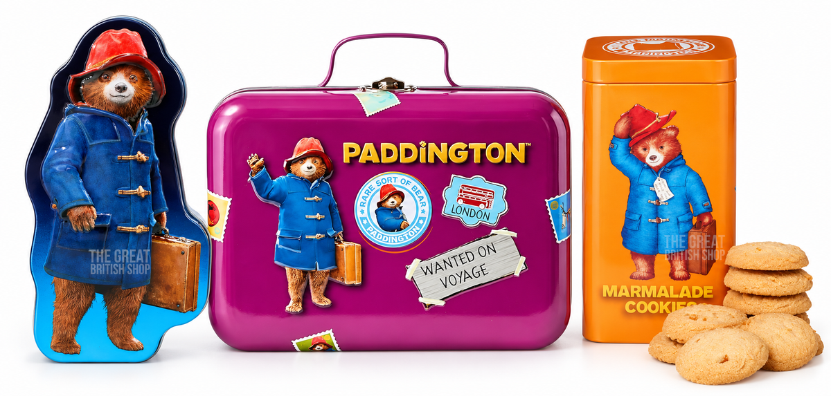 Paddington Bear Shaped Tin With Shortbread Biscuits - 100g; Paddington Bear Suitcase Tin With Orange Marmalade Chocolate Chunk Cookies - 300g; Paddington Bear Tin With Marmalade Cookies, Breakfast Tea & Vegan Jelly Sweets - 100g