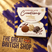 McVitie’s Victoria Chocolate Creations carton on a violet and gilt textured surface with The Great British Shop branding engraved into the gold.