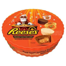 Reese's Gift Tin 309g: round orange tin lid with DJ Santa and peanut butter cups shown.
