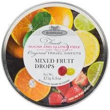 Simpkins Mixed Fruit Drops Sugar Free 175g: front of the round tin showing fruit images and lid.